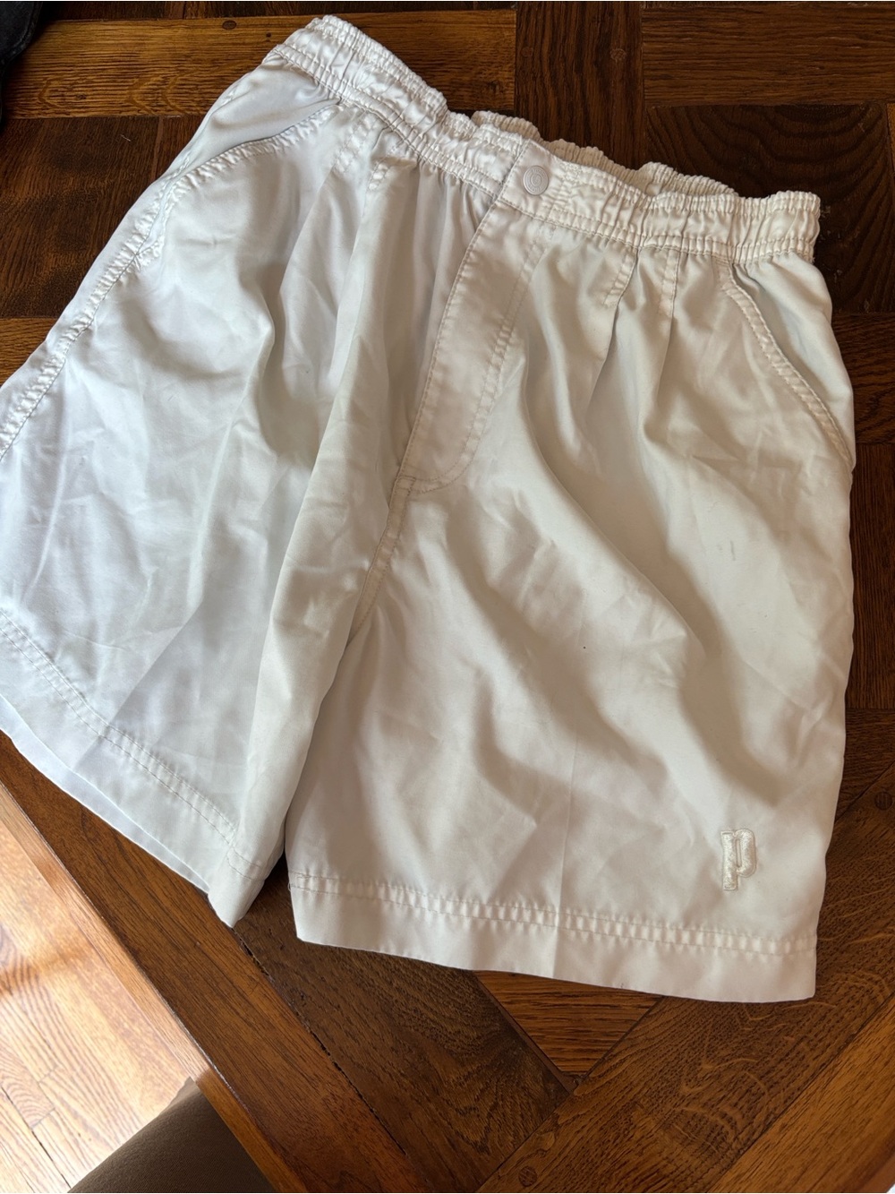 Prince White Athletic Shorts with Green Logo Tag